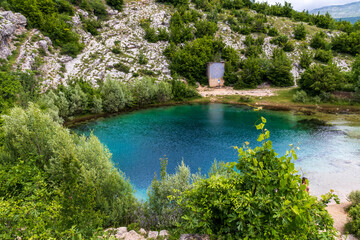 Fototapeta premium adriatic, beautiful, blue, cave, cetina, cetina river spring, church, countryside, creek, croatia, dalmatia, environment, flowing, freshwater, green, karst, lake, landscape, mediterranean, natural, na