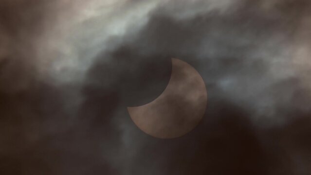 Solar eclipse view through a telescope and a special solar filter.	