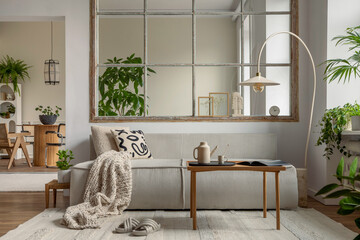 Interior design of open space interior with modular sofa, big window, stylish lamp, wooden coffee...