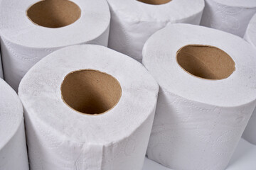White and hygienic toilet papers on a clean toilet counter. 