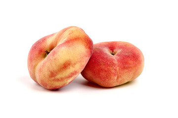 Flat peaches, isolated on white background.