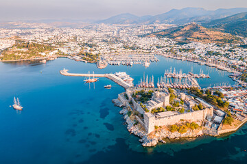 Bodrum ancient castle with Bodrum marina at sunrise, aerial view - obrazy, fototapety, plakaty
