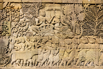 Picturial stories carved into the wall at the Unesco World Heritage site of Ankor Thom, Siem Reap,...