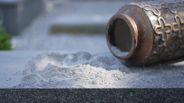 open urn for ashes in the cemetery close-up ,no body