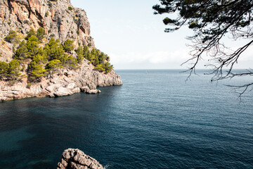 Torrent de Pareis Sa Calobra Mallorca, Spain. Beautiful sunset beach landscape, exotic tropical island nature, blue sea water, ocean waves, summer holidays vacation