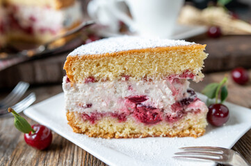 Cherry cream  Cake on wooden background. close-up with selective focus 