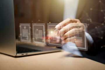 Businessman using computer for Document Management System (DMS) and online documentation database, paperless office concept