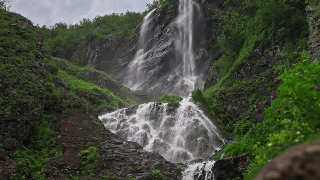 Polykar's waterfall at Krasnaya Polyana in Sochi. A beautiful waterfall in the mountains is a popular place for tourists.