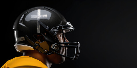 Team Jesus. American football player with white cross on helmet on black background