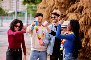 Group of friends having fun while partying together outdoors. Party and friendship concept.