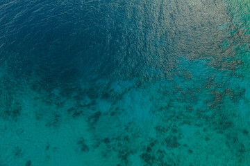 Aerial top down view of crystal sea surface water, static shot for background