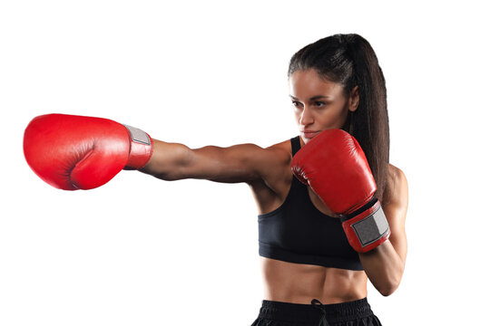 Kickboxing woman in activewear and red kickboxing gloves on a transparent background performing a martial arts kick. Sport exercise, fitness workout.