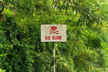 Go Slow sign Board on the road