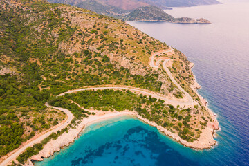 Aerial view of coastal serpentine windy road along Aegean sea