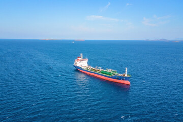 Aerial drone view of oil chemical tankers anchored near port of oil chemical plant