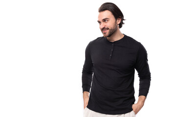 Fototapeta premium authentic brutal macho man with black hair and beard with an earring in his ear isolated on white background with copy space