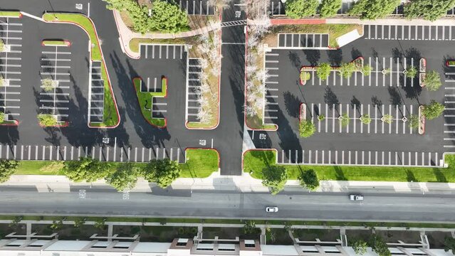 up top view empty new parking lot with cars driving in the main road 
at Rancho Cucamonga CA