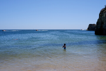 Fototapeta na wymiar On a beach of Lagos, Portugal, the summer of 2023.