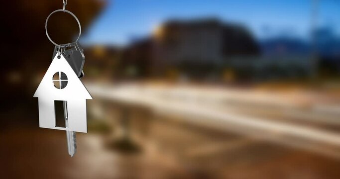 Animation of hanging silver house keys against blurred view of city traffic with copy space