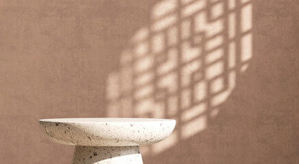 White cream round terrazzo podium table, in sunlight and Chinese window grill shadow on blank brown...