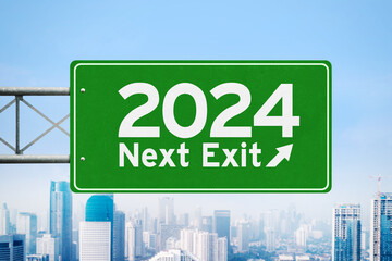Text of 2024 next exit on green road board with misty city background