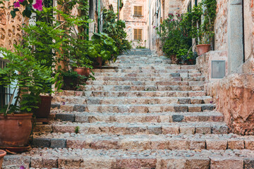 Fototapeta na wymiar View of a medieval street in the Old Town of the picturesque Spanish-style village Fornalutx, Majorca or Mallorca island