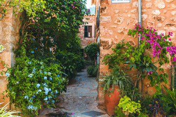 Fototapeta na wymiar View of a medieval street in the Old Town of the picturesque Spanish-style village Fornalutx, Majorca or Mallorca island