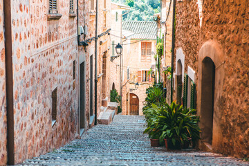 View of a medieval street in the Old Town of the picturesque Spanish-style village Fornalutx,...