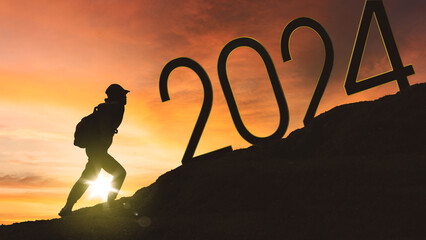 People climbing mountains with 2024 numbers
