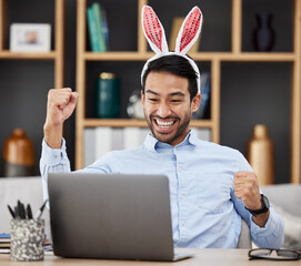 Bunny ears, easter and winning by business man excited, happy and celebrate in an office with success. Winner, rabbit and employee or person with victory, achievement and using a laptop for profit