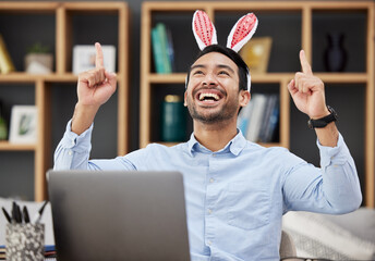 Bunny ears, easter and celebration by business man excited, happy and winning in an office with success. Winner, rabbit and employee or person with victory, achievement and using a laptop for profit