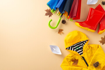Fashionable waterproof ensemble for kids. Photograph top-down view of vibrant scene featuring...