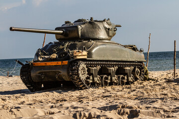 Fototapeta premium An American World War II Sherman tank on the beach.