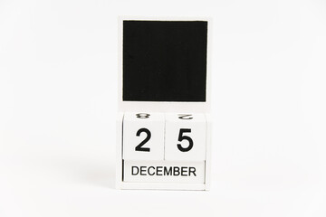 Wooden calendar with the date December 25 on a white background. The concept of preparing for the Christmas and New Year holidays.