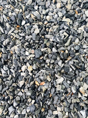 Gray flake stone detail texture background, Construction
material small stone, Garden stone, Pattern small rocks vertical wallpaper