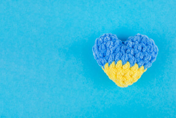 blue yellow heart on blue background
