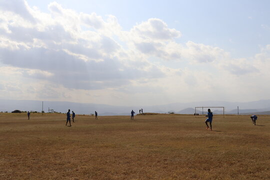 AIC TTI and Kamere Hotstars engage in a football match in the mountains. 