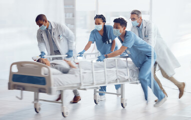 Doctors, team and hurry with bed in hospital for medical emergency, surgery operation and first aid...