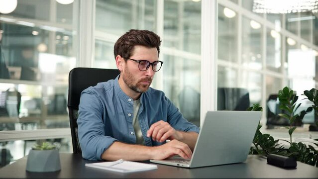 Demotivated tired sleepy man lazy boring male manager in glasses sleep at workplace try to work. Manager syndrome, insomnia, exhaustion, stress, fatigue, overwork, sleep disorder concepts.