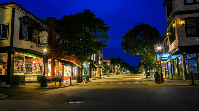 BAR HARBOR, MAINE, USA - JULY 10, 2023:  Beautiful morning view from Main Street without people and   with lights on