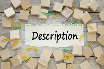 Description text on torn paper.near wooden cubes