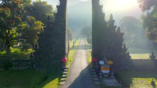 iconic Balinese attraction, Bedegul gate at sunrise, drone flying through the ancient gate, Bali culture, vacation in Bali, tourism in Indonesia