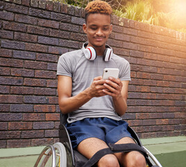 Phone, wheelchair and outdoor man with disability typing internet, web or online search for fitness training information. Cellphone communication, reading and African person post to social media app