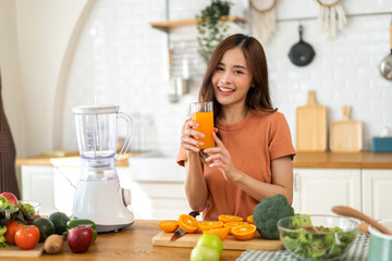 Portrait of beauty body slim healthy asian woman drinking glass of juice and orange.young girl...