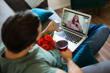 Beautiful romantic couple on a virtual date and video call - obrazy, fototapety, plakaty