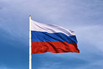 Large flag of the Russian Federation on a flagpole 75 meters high. Technological device with wind...