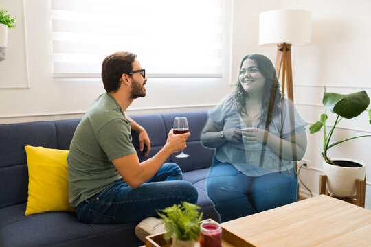 Young man on a virtual date talking with his AR girlfriend in the metaverse - Powered by Adobe