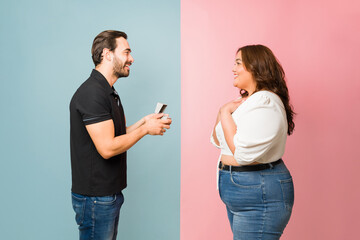Romantic man getting engaged with his excited girlfriend