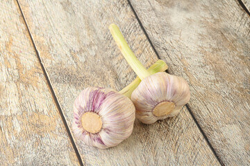 Two Young garlic over background