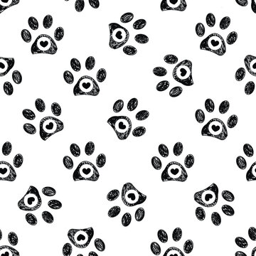 Doodle black paw prints with black hearts seamless fabric design repeated pattern